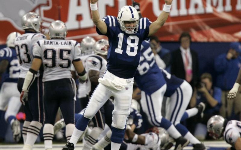 Indianapolis Colts quarterback Peyton Manning (18) celebrates running back Joseph Addai's three-yard touchdown run in the fourth quarter of the AFC Championship game against the New England Patriots on Jan. 21, 2007, in Indianapolis. (AP FILE PHOTO)
