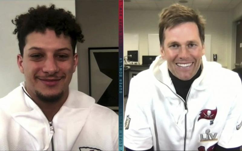 In this still image from video provided by the NFL, Kansas City Chiefs quarterback Patrick Mahomes, left, and Tampa Bay Buccaneers quarterback Tom Brady speak during Opening Night for Super Bowl 55 on Monday. (NFL)