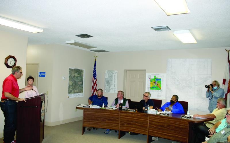 Lake City Councilman Todd Sampson talks to the Fort White Town Council about the city providing utility services to Fort White at a meeting Monday. (TONY BRITT/Lake City Reporter)