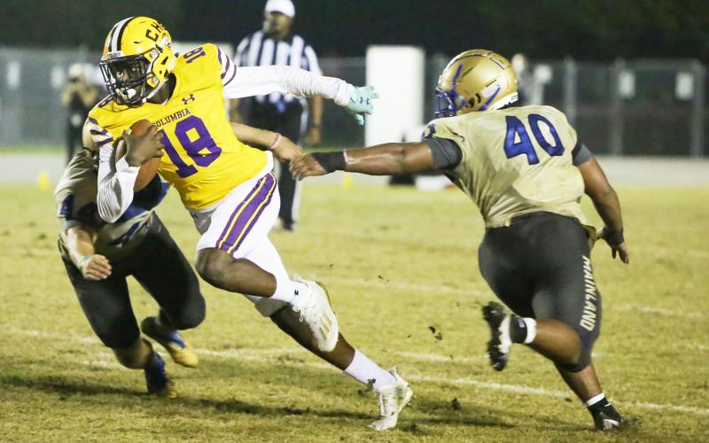 Columbia receiver Marcus Peterson fights through a Daytona Beach Mainland tackler during a Region 1-6A playoff last season. (FILE)