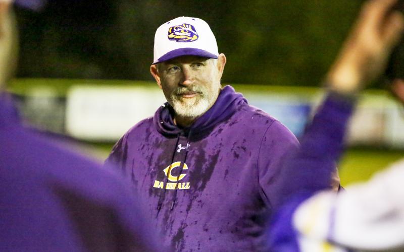 Columbia coach Brian Thomas smiles after receiving an ice-water bath from his team following the Tigers’ 13-1 win over Bradford on Wednesday night, which gave Thomas 300 victories in his career. (BRENT KUYKENDALL/Lake City Reporter)