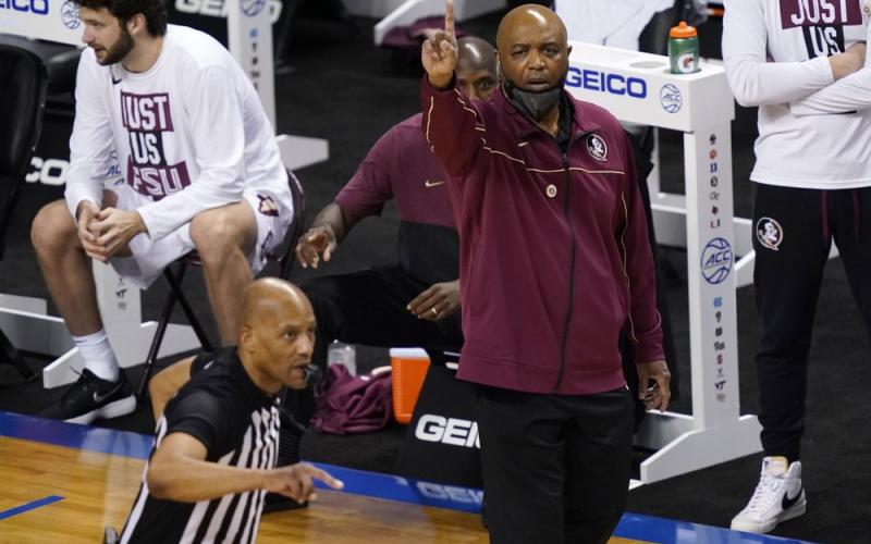 Florida State head coach Leonard Hamilton directs his team during the first half of a game against North Carolina in the semifinal round of the Atlantic Coast Conference Tournament on March 12 in Greensboro, N.C. (GERRY BROOME/Associated Press)