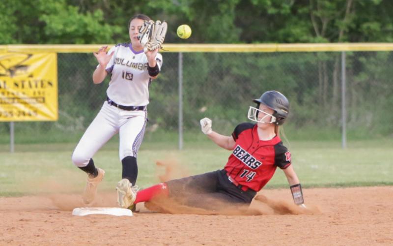 Columbia second baseman Sofia Arata can’t hold onto a throw as Dixie County left fielder Emily Chewning slides safely into second base Monday night. (BRENT KUYKENDALL/Lake City Reporter)