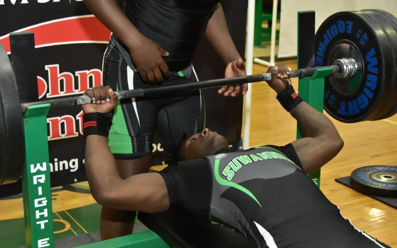 Suwannee’s Jaquez Moore performs the bench press during Thursday’s District 3-2A Meet. (ROB WOLFE/Special to the Reporter)