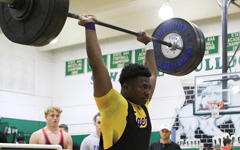 Columbia’s Julius Moreland finishes his clean and jerk during the Region 1-2A Meet on Friday. (PAUL BUCHANAN/Special to the Reporter)