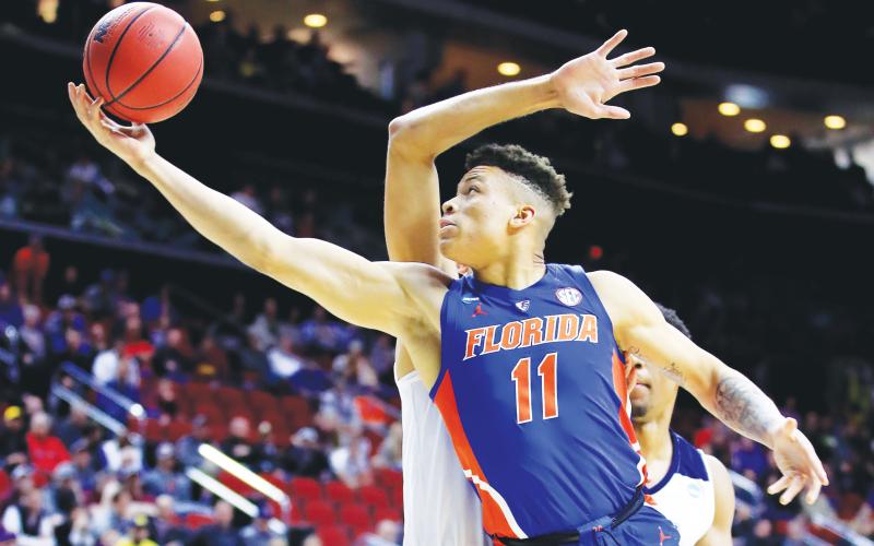 Florida forward Keyontae Johnson, seen here in a 2019 game, was hospitalized in critical but stable condition after collapsing on court during a game against Florida State last season. (ANDY LYONS/Getty Images/TNS)