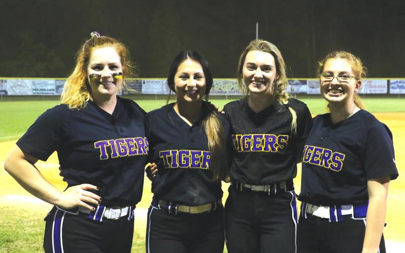 Columbia seniors Reece Chasteen (from left), Sofia Arata, Anissa Penniman and Caitlyn O’Sullivan helped lead the Tigers to a 13-3 over Hamilton County on Senior Night. (MORGAN MCMULLEN/Lake City Reporter)