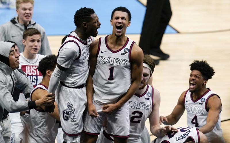 Gonzaga guard Jalen Suggs (1) celebrates making the game-winning basket with Joel Ayayi, left, against UCLA during overtime in the Final Four semifinal game at Lucas Oil Stadium on Saturday in Indianapolis. Gonzaga won 93-90. (MICHAEL CONROY/Associated Press)