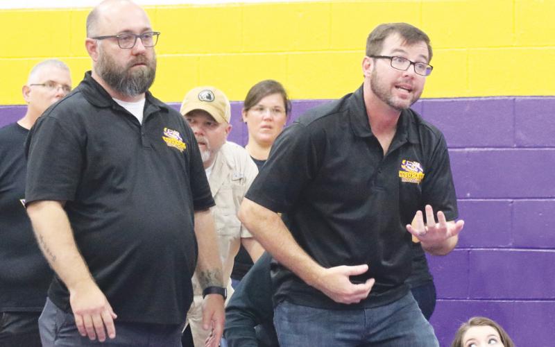 Columbia wrestling coach Pete Whittington (right) yells out instructions to a wrestler during the Tiger Duals in 2020. (JORDAN KROEGER/Lake City Reporter)