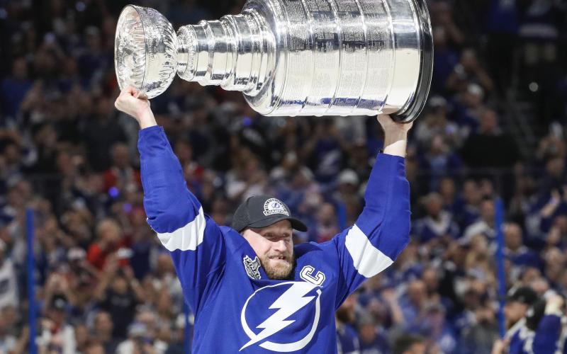 Tampa Bay Lightning center Steven Stamkos hoists the Stanley Cup after the Lightning defeated the Montreal Canadiens 1-0 in Game 5 Wednesday in Tampa. (DIRK SHADD/Tampa Bay Times/TNS)