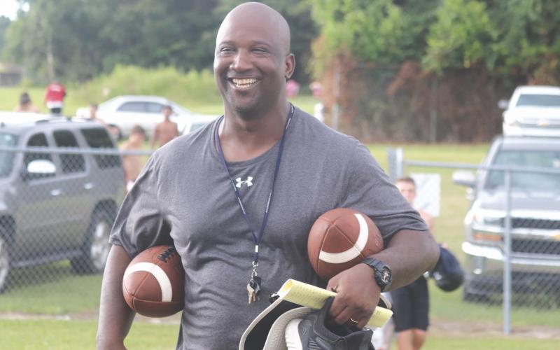 Demetric Jackson smiles during a Fort White practice in 2019. Jackson is leaving FWHS to take over as head coach at Columbia. (FILE)