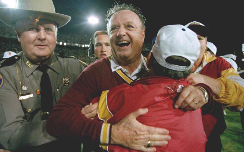 Florida State University head football coach Bobby Bowden, center, receives a congratulatory hug after FSU defeated Nebraska 18-16 in the Orange Bowl on  Jan. 1, 1994, in Miami. (AP FILE)