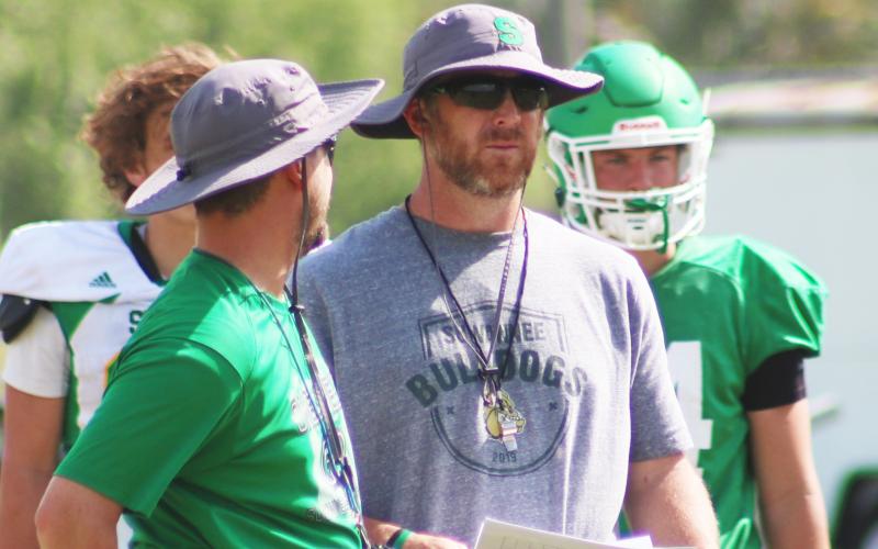 Suwannee coach Kyler Hall (right) looks on during spring practice in April. (JAMIE WACHTER/Lake City Reporter)