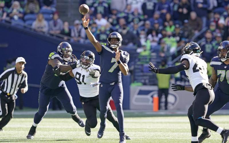 Seattle Seahawks quarterback Geno Smith throws a pass against the Jacksonville Jaguars on Sunday in Seattle. (TED S. WARREN/Associated Press)