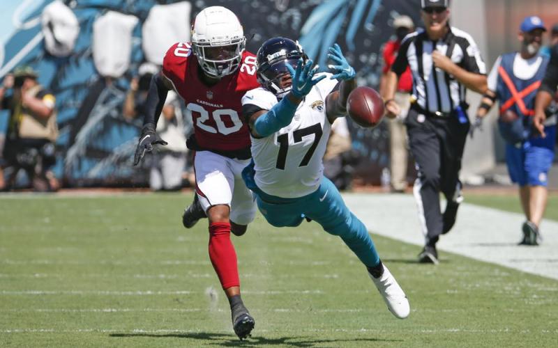 Jacksonville Jaguars wide receiver D.J. Chark dives but can't make a catch as he is defended by Arizona Cardinals cornerback Marco Wilson on Sept. 26 in Jacksonville. (STEPHEN B. MORTON/Associated Press)