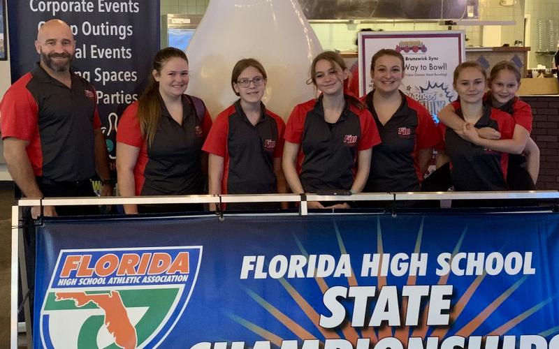 Fort White’s state bowling team: head coach Steven Hill, Alyssa Marlowe, Khloe Schmidt, Stephanie Selman, Alexis Wooley, Shelbie Wagner and Reagan Falotico. (COURTESY)