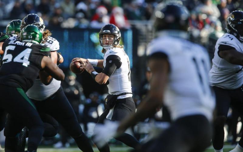 Jacksonville Jaguars quarterback Trevor Lawrence throws a pass to Marvin Jones (11) during Sunday’s game against the New York Jets in East Rutherford, N.J. (JOHN MUNSON/Associated Press)