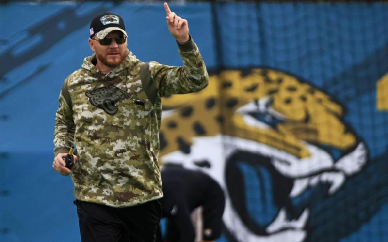Jacksonville Jaguars interim head coach Darrell Bevell, an offensive coordinator under former coach Urban Meyer, leads practice on Thursday at TIAA Bank Field's practice field in Jacksonville. Bevell took over after Meyer was fired. (COREY PERRINE/Florida Times-Union via AP)
