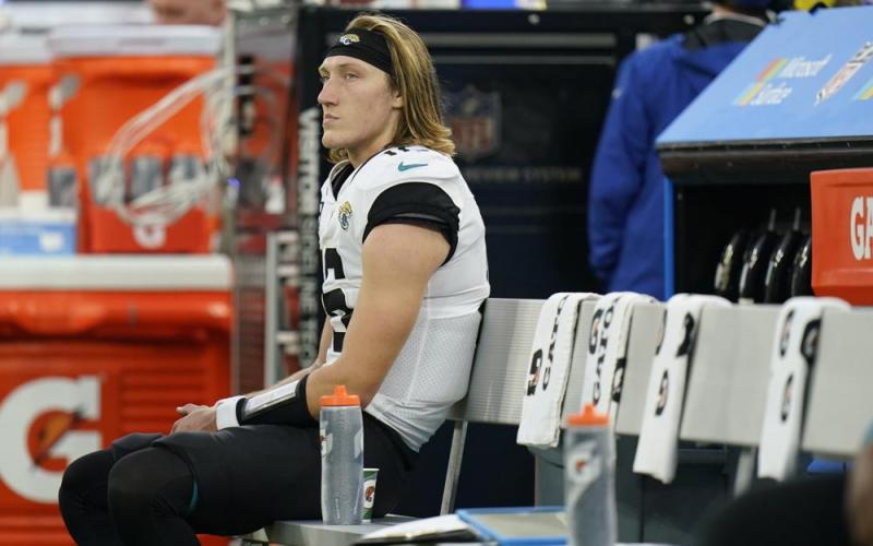 Jacksonville Jaguars quarterback Trevor Lawrence sits on the bench in the closing minutes of Sunday's loss to the Los Angeles Rams in Inglewood, Calif. (JAE C. HONG/Associated Press)