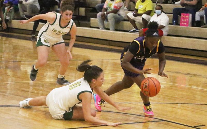 Columbia guard Anzarria Jerkins steals the ball away from Fleming Island guard Kennedy Williams. (MORGAN MCMULLEN/Lake City Reporter)