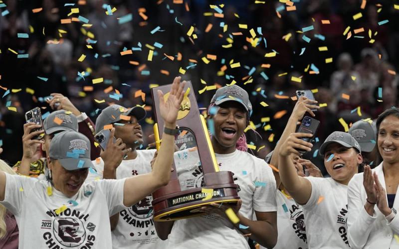 South Carolina's Aliyah Boston holds the trophy after defeating UConn in the NCAA national championship on Sunday in Minneapolis. South Carolina won 64-49 to win the championship. (ERIC GAY/Associated Press)
