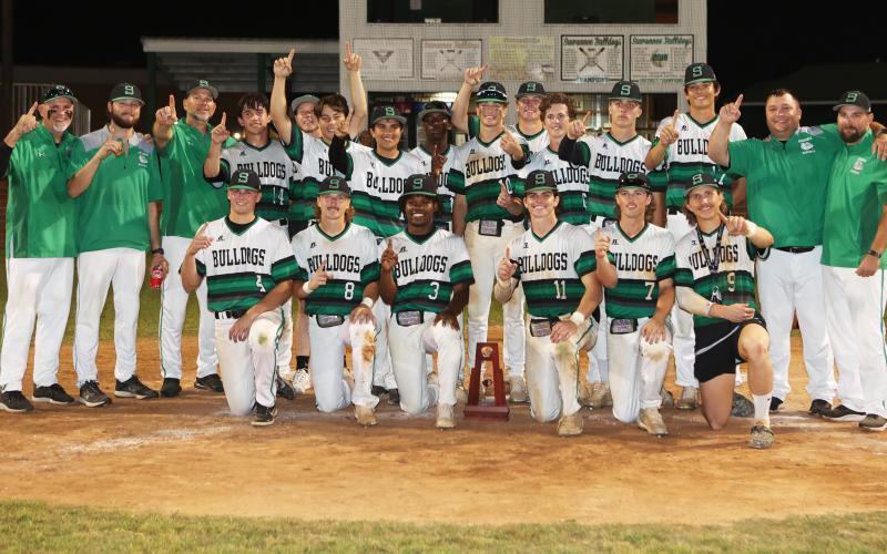 Suwannee's baseball team poses with the Region 1-4A championship trophy after defeating Bishop Kenny on Tuesday night. (PAUL BUCHANAN/Special to the Reporter)