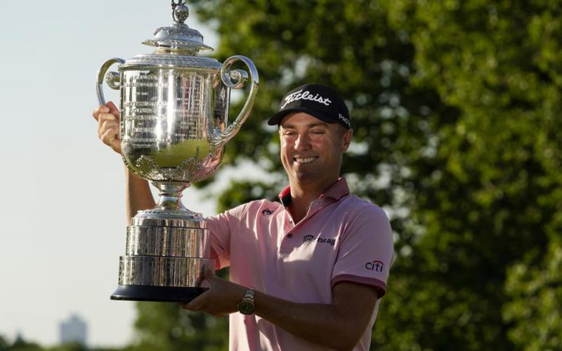 Justin Thomas holds the Wanamaker Trophy after winning the PGA Championship in a playoff against Will Zalatoris at Southern Hills Country Club on Sunday in Tulsa, Okla. (ERIC GAY/Associated Press)