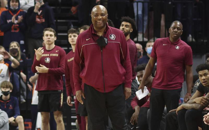 Florida State head coach Leonard Hamilton smiles from the bench during a a game against Virginia on Feb. 26 in Charlottesville, Va. (AP FILE)
