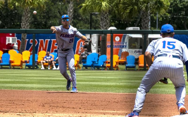 Florida's Sterlin Thompson throws to first base for an out against Central Michigan during Sunday's NCAA regional game in Gainesville. (CYNDI CHAMBERS/Ocala Star-Banner via AP)