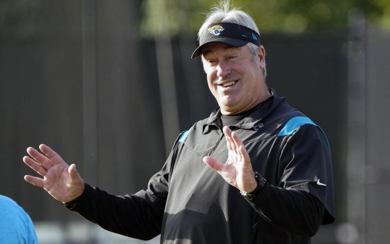 Jacksonville Jaguars head coach Doug Pederson greets players as they arrive at practice on Saturday in Jacksonville. (JOHN RAOUX/Associated Press)