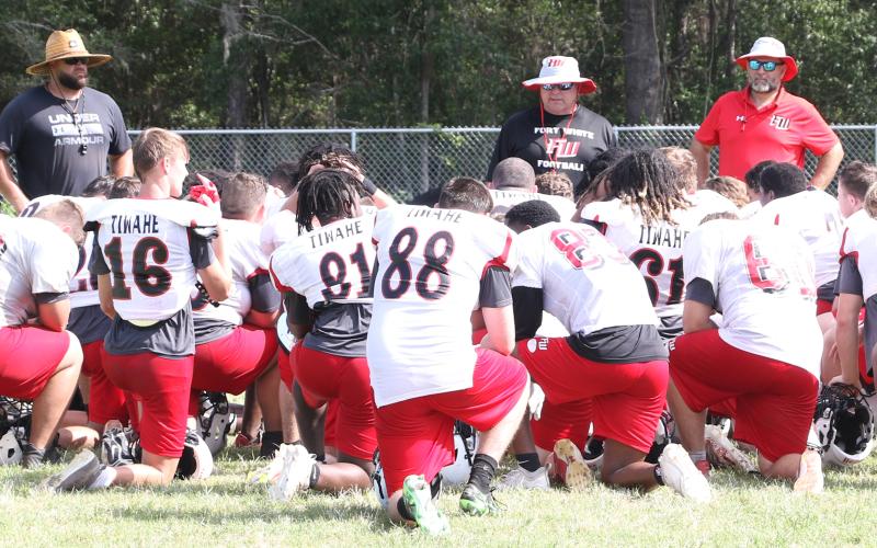 Fort White head coach Lee Dorsett speaks to his team following Wednesday’s practice. (MORGAN MCMULLEN/Lake City Reporter)