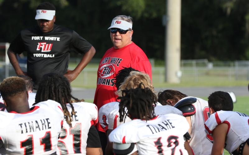 Fort White head coach Lee Dorsett addresses his team following a team scrimmage on Aug. 12. (MORGAN MCMULLEN/Lake City Reporter)