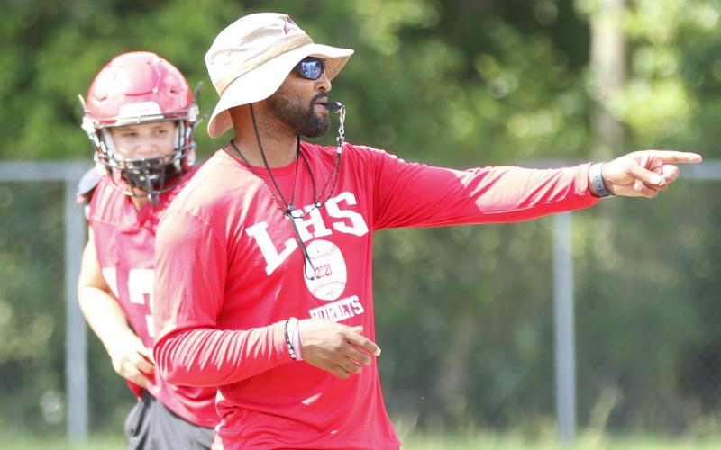 Lafayette head coach Marcus Edwards signals to players during Wednesday’s practice. (JAMIE WACHTER/Lake City Reporter)