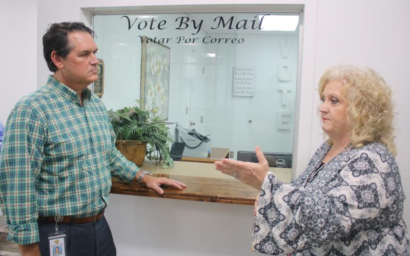 Columbia County Supervisor of Elections Tomi Brown (right) talks with Florida Secretary of State Cord Byrd Monday afternoon. (TONY BRITT/Lake City Reporter)