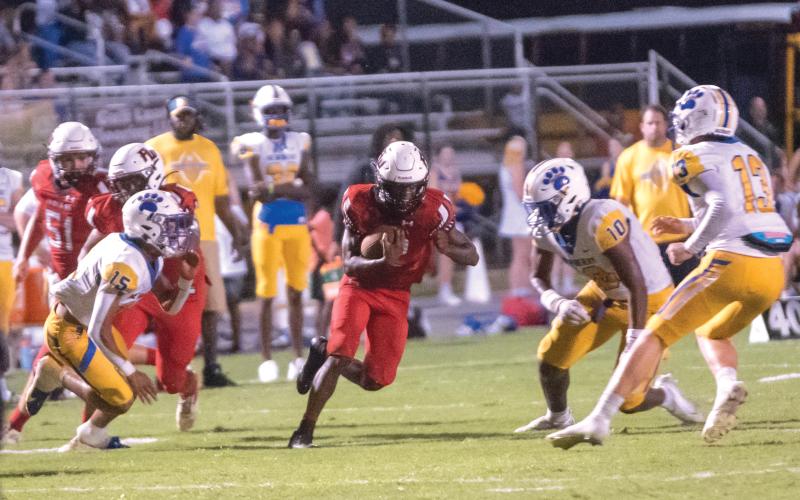 Fort White’s Najeeb Smith looks for a crease in the Newberry defense in the Indians’ 34-17 loss last week. (CHRISTINA FEAGIN/Special to the Reporter)