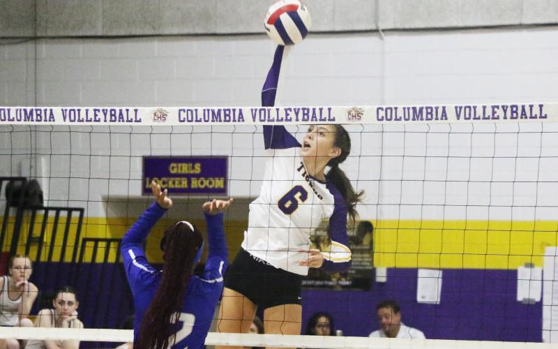 Columbia’s Sinei Wood rises to hit a shot against St. Francis Catholic on Monday. (MORGAN MCMULLEN/Lake City Reporter)