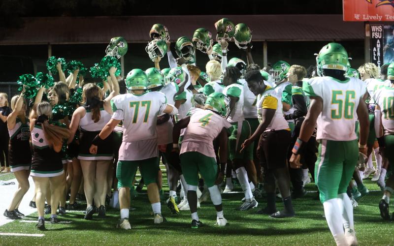 Suwannee’s football team celebrates after defeating Wakulla 22-14 to win the District 4-2S title on Friday. (PAUL BUCHANAN/Special to the Reporter)