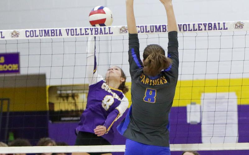 Columbia’s Haidyn Markham fires a shot over the net against Newberry on Tuesday night. (BRENT KUYKENDALL/Lake City Reporter)