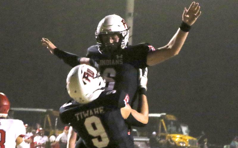 Fort White quarterback Clayton Philpot (6) celebrates with tight end Avery Giddens (9) after scoring on a touchdown run against Lafayette last Friday. (MORGAN MCMULLEN/Lake City Reporter)