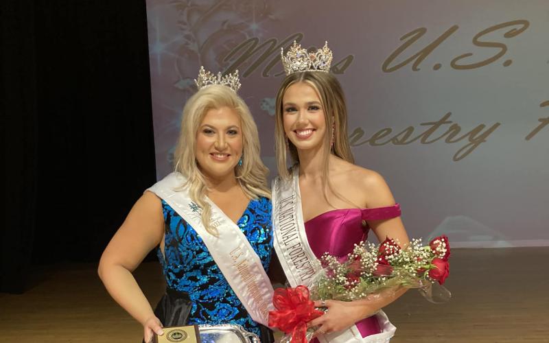Maddie Kelley (left) and Manda Perry celebrate their respective wins for Ms. U.S. National Turpentine Queen and Miss U.S. National Forestry Queen on Saturday. (COURTESY)