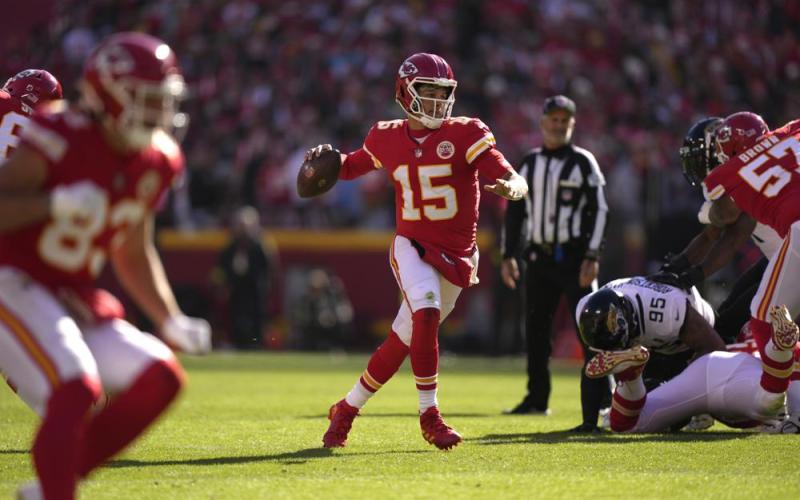 Kansas City Chiefs quarterback Patrick Mahomes runs as he throws as touchdown pass to wide receiver Marquez Valdes-Scantling against the Jacksonville Jaguars on Sunday in Kansas City, Mo. (CHARLIE RIEDEL/Associated Press)