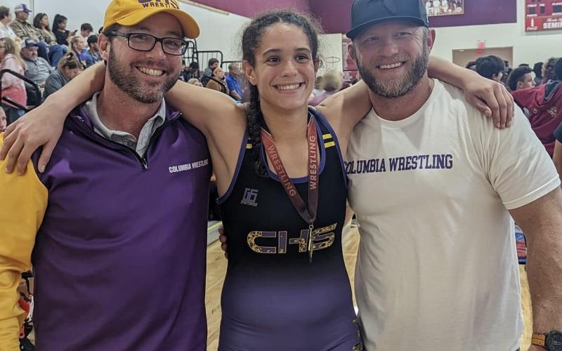 Columbia wrestler Carlee Morrison (middle) won the 145 class in the girls division at the Cam Brown Invitational on Saturday. (COURTESY)