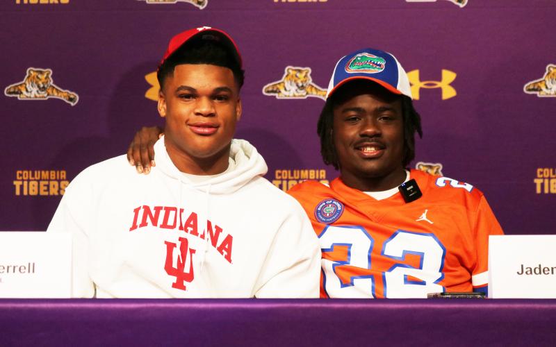 Columbia safety Amare Ferrell (left) signed his letter of intent with Indiana while linebacker Jaden Robinson (right) signed with Florida on Wednesday. (JORDAN KROEGER/Lake City Reporter)