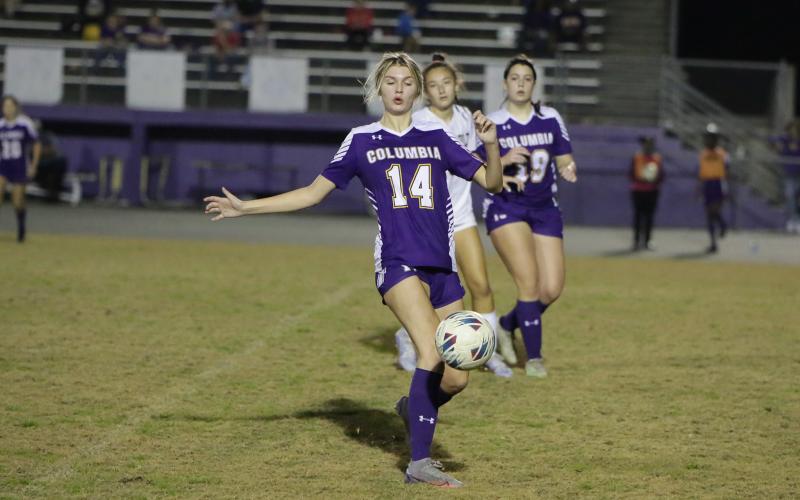 Columbia's Mia Brasel corrals the ball during Tuesday's match against Buchholz. (BRENT KUYKENDALL/Lake City Reporter)
