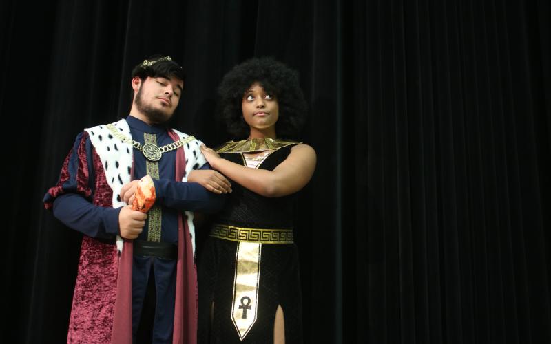Gian Rivera (from left) portraying King Henry VIII, and Leondra Brown, portraying Cleopatra, rehearse scenes for the upcoming dinner-theatre production ‘Night at the Wax Museum.’ (TONY BRITT/Lake City Reporter)