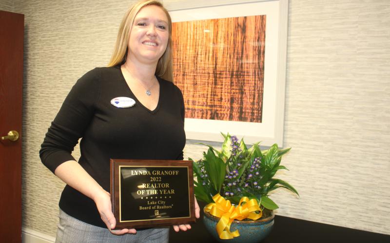 Lynda Granoff poses with her award after winning the 2022 Realtor of the Year honor from the Lake City Board of Realtors. (TONY BRITT/Lake City Reporter)