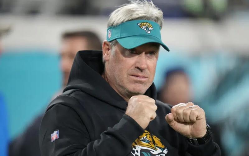 Jacksonville Jaguars head coach Doug Pederson walks the turf before his team’s wild-card playoff game against the Los Angeles Chargers last Saturday in Jacksonville. (JOHN RAOUX/Associated Press)