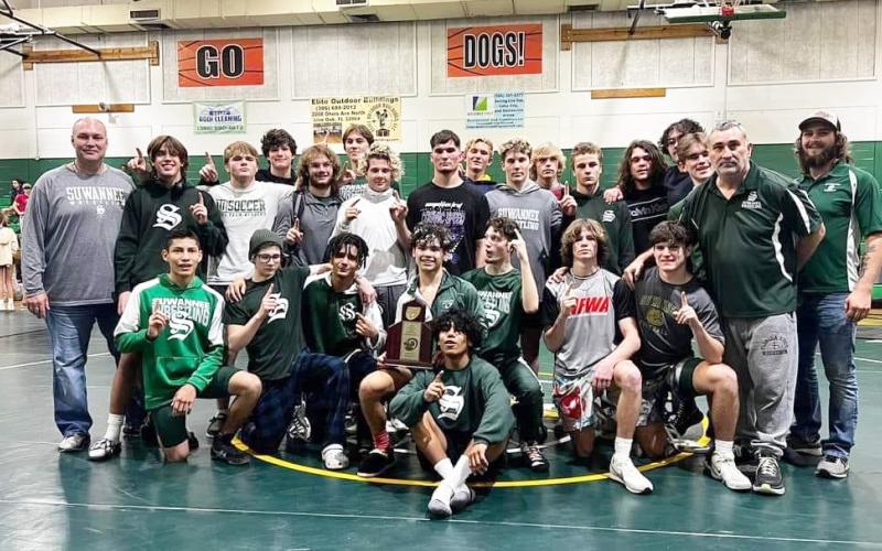 Suwannee’s wrestling team celebrates after winning the District 2-1A duals on Thursday. (COURTESY)