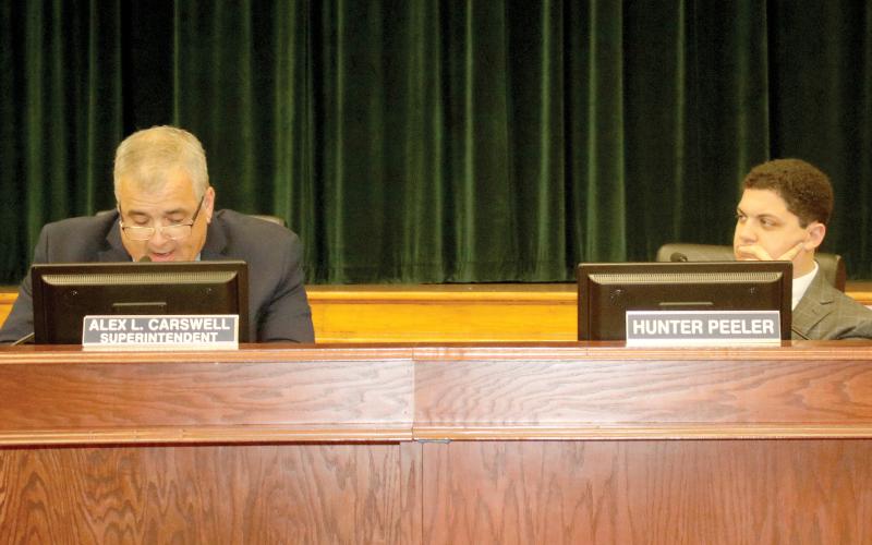 Hunter Peeler (right), the school board member for District 5, suggested to Superintendent Lex Carswell the district resume live-streaming board meetings. (TONY BRITT/Lake City Reporter)