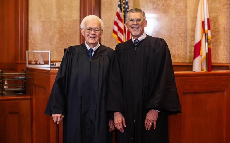 Retired Circuit Judge Paul Bryan (right) remembered Judge John Peach as ‘a fine gentleman’ after Peach’s death Wednesday. (COURTESY)